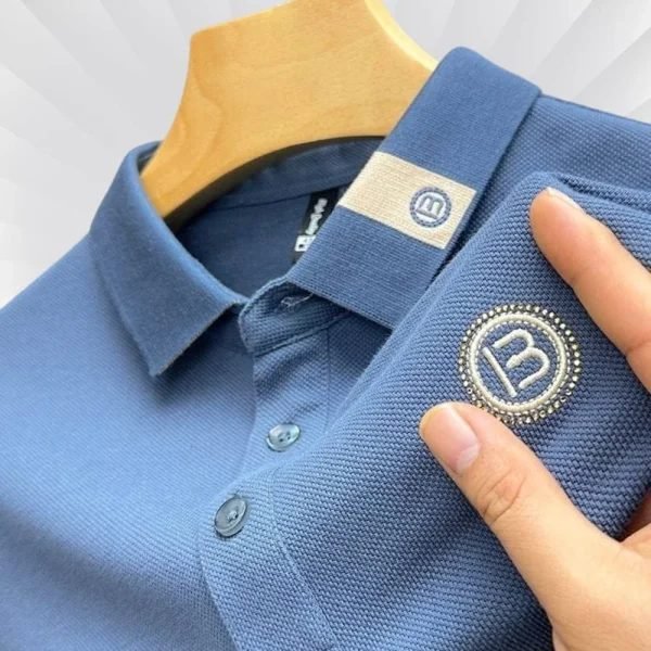 Blue polo shirt with badge